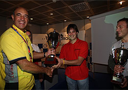 Oscar Nogués is receiving the cup for the winner of the first year of the Seat León Eurocup series