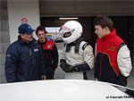 Drivers Petr Fulín and Tadeáš Martínek are talking to mechanic Zdeněk Bartoš