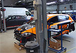 The SUNRED company's workshops with the SEAT race car being prepared for Michal Matějovský (his is the more distant car)