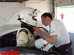 Adjusting Petr's racing outfit (a photograph from the VEKRA-CSMS Racing Team's pits)