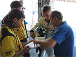 Michal Matějovský, consulting with Joan Orus and the mechanics in the course of the testing