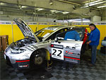 The car is being checked by technical inspectors in the SUNRED-BRT team's pits