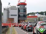 The Seat cars, approaching the circuit for the Friday free-practice session