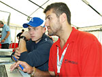 Michal and the SUNRED company's engineer are studying telemetry results before Race 1