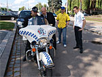 A police officer is explaining the technical parameters of the famous motorcycles