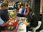 Autographing event of racing driver Michal Matějovský at the 2009 Autosalon Brno motor show